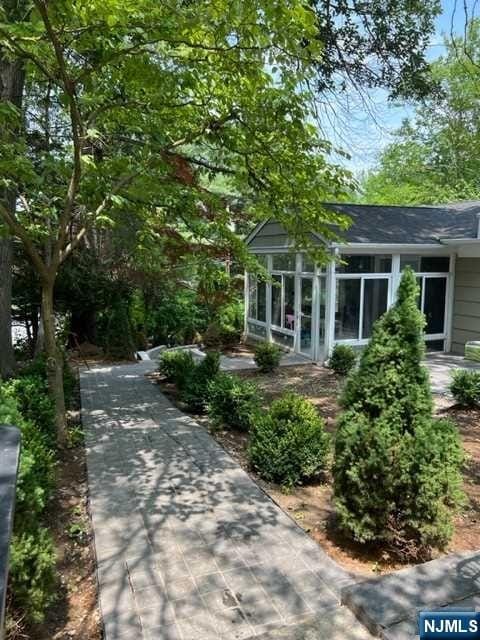 view of side of property with a sunroom