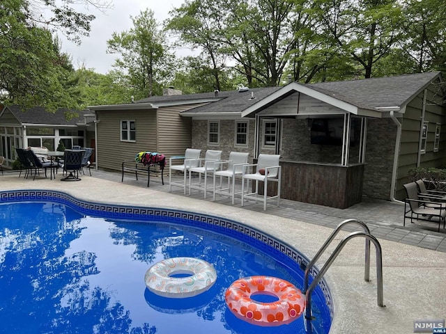 view of pool featuring a patio area