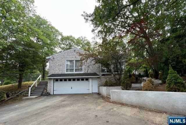 view of property exterior with a garage