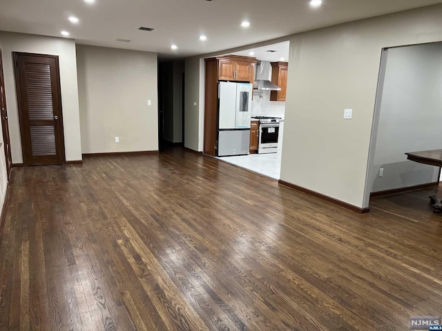 unfurnished living room featuring dark wood-type flooring