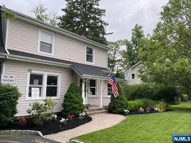 view of front of home with a front yard