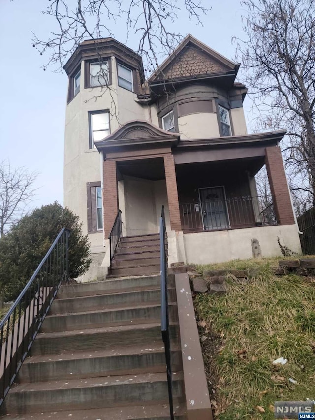 victorian home featuring covered porch