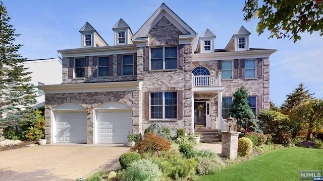 view of front facade featuring a balcony and a garage