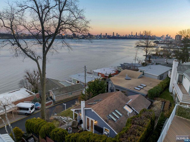 aerial view at dusk with a water view