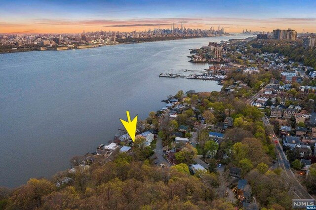 aerial view at dusk with a water view