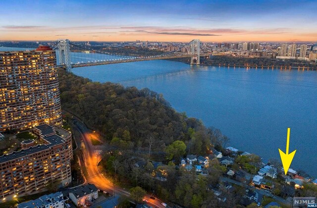 aerial view at dusk with a water view