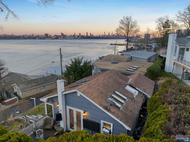 aerial view at dusk with a water view