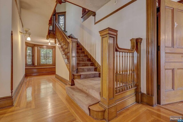 staircase with a towering ceiling