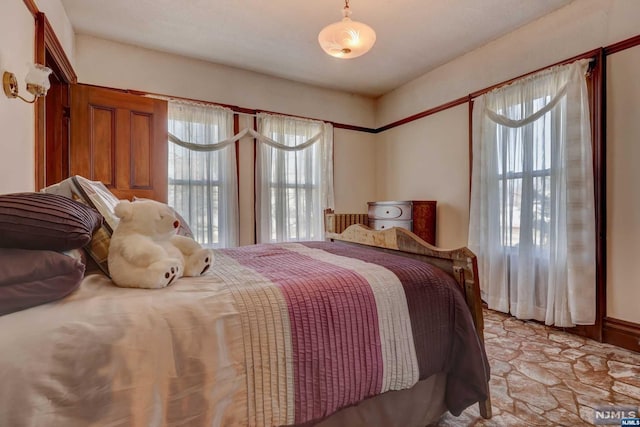 bedroom featuring multiple windows