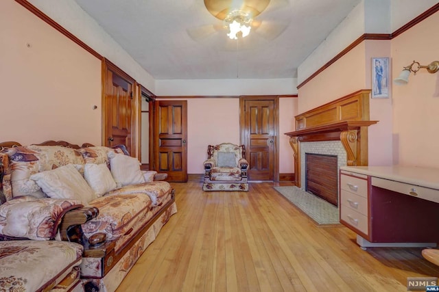 living room featuring ceiling fan and light hardwood / wood-style flooring