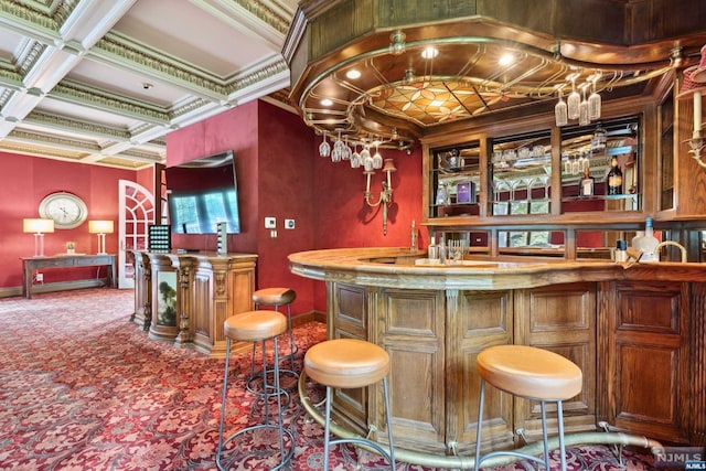 bar with carpet flooring, beam ceiling, ornamental molding, and coffered ceiling