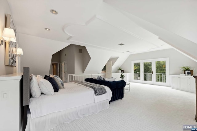 carpeted bedroom featuring lofted ceiling