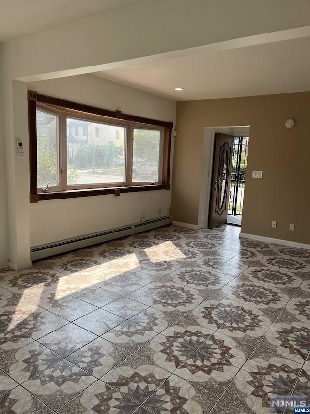 spare room featuring baseboard heating