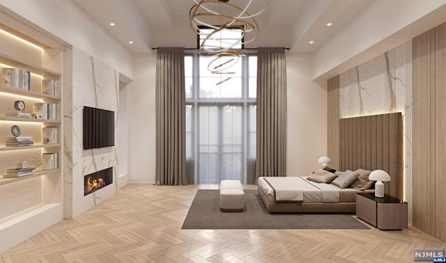 bedroom with a notable chandelier, a towering ceiling, a fireplace, and light parquet floors