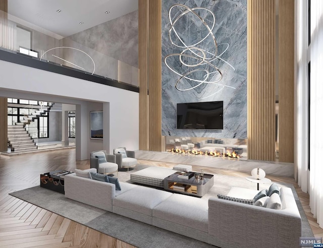 living room with a towering ceiling and parquet flooring