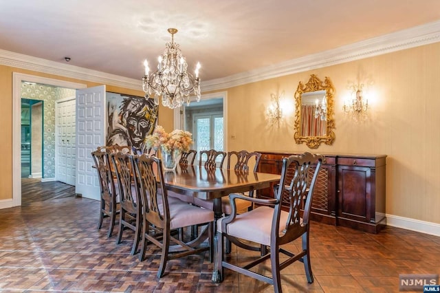 dining space featuring crown molding, french doors, and an inviting chandelier