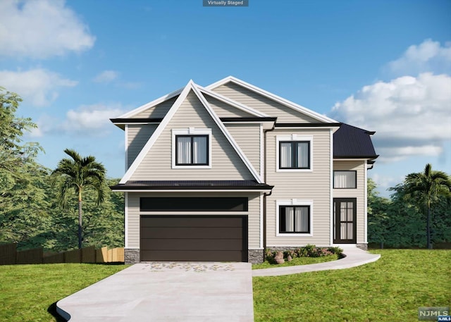 view of front of property featuring a front yard and a garage