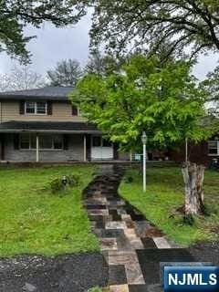 view of front of home with a front yard