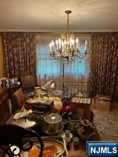 dining space with an inviting chandelier