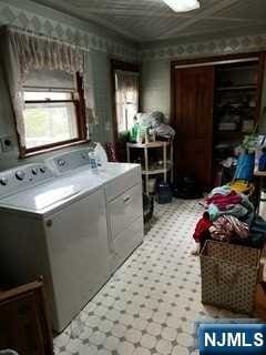 laundry room with washer and dryer