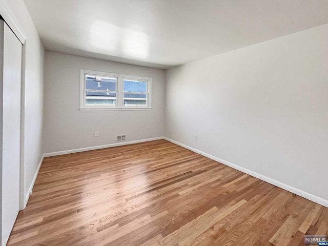 unfurnished bedroom with light hardwood / wood-style floors