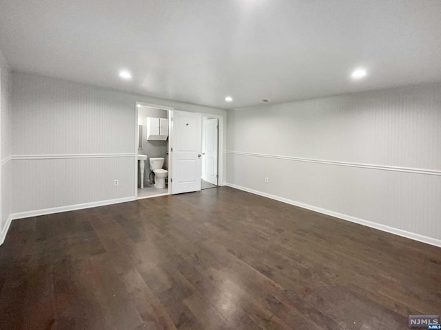 unfurnished living room featuring dark hardwood / wood-style floors