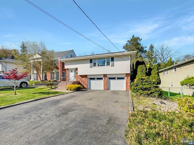 view of front of property featuring a garage and a front yard