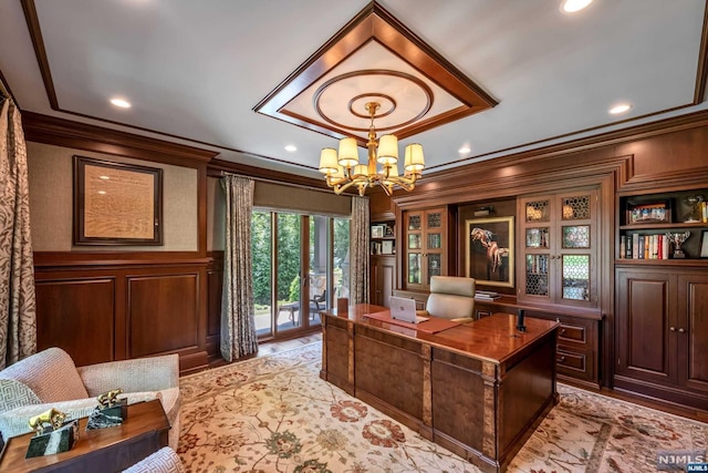 office featuring crown molding and a chandelier