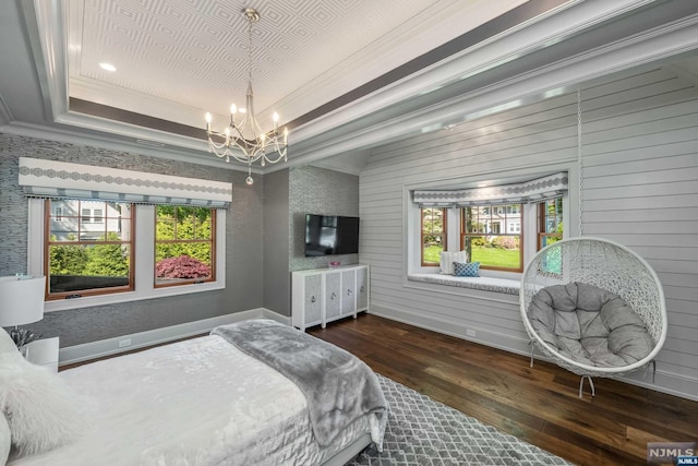 bedroom featuring dark hardwood / wood-style flooring, multiple windows, ornamental molding, and wood walls