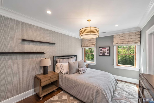 bedroom with hardwood / wood-style floors and ornamental molding