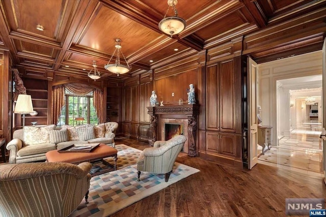 sitting room featuring hardwood / wood-style floors, wood walls, crown molding, and wood ceiling