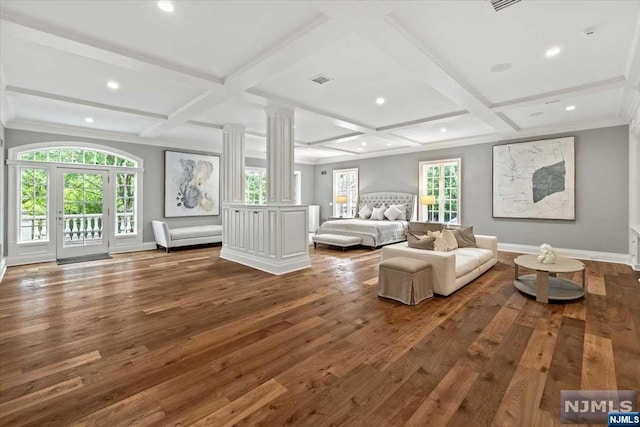 unfurnished bedroom with access to outside, coffered ceiling, hardwood / wood-style flooring, ornate columns, and beamed ceiling