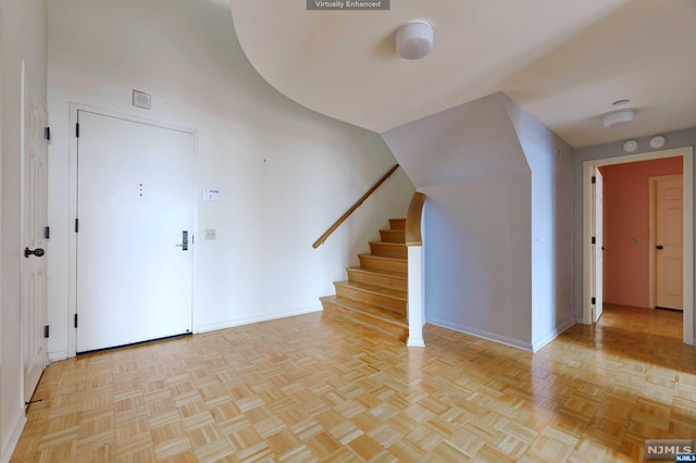 entrance foyer with light parquet floors