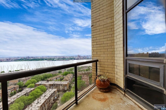 balcony featuring a water view