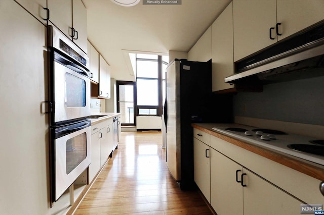 kitchen featuring light hardwood / wood-style flooring and stainless steel appliances