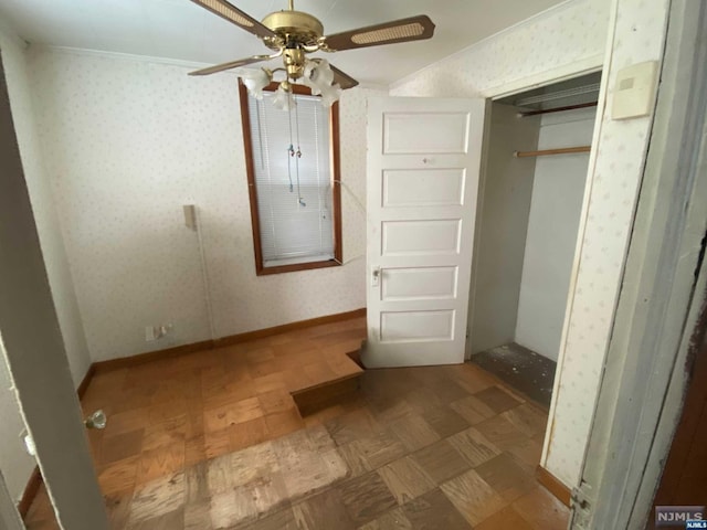 unfurnished bedroom with wood-type flooring, a closet, ceiling fan, and ornamental molding