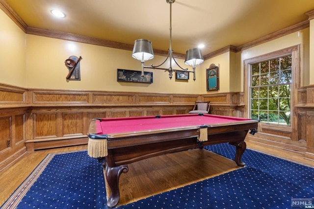 recreation room featuring hardwood / wood-style flooring, ornamental molding, and billiards