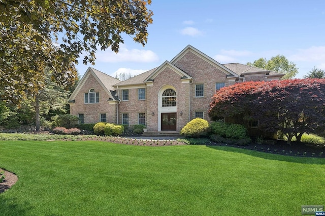 view of property with a front lawn