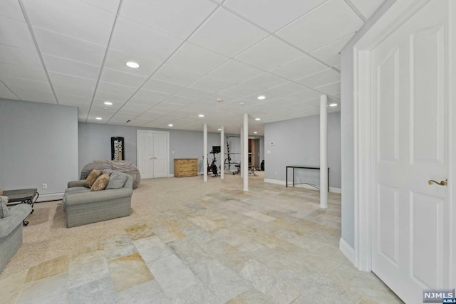 basement featuring a paneled ceiling