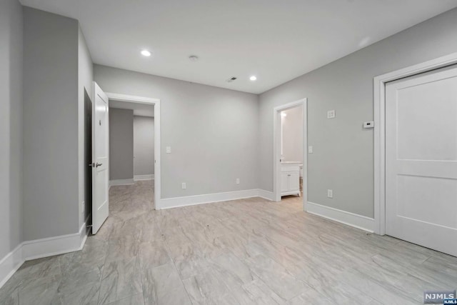 unfurnished bedroom featuring ensuite bath