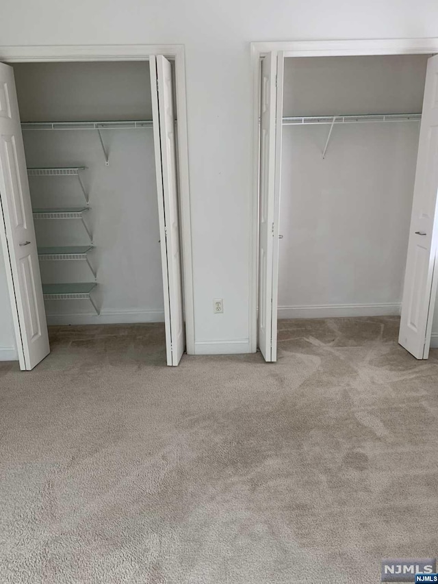 unfurnished bedroom with light carpet