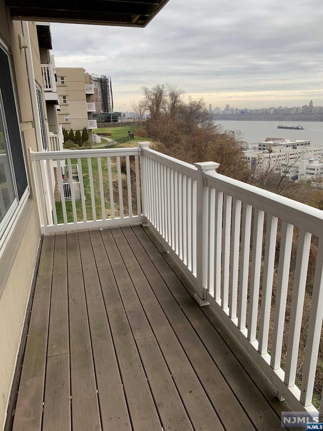 wooden deck with a water view