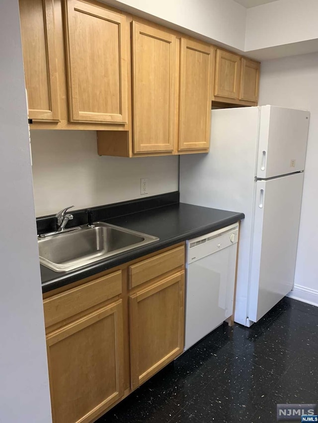 kitchen featuring sink and white appliances