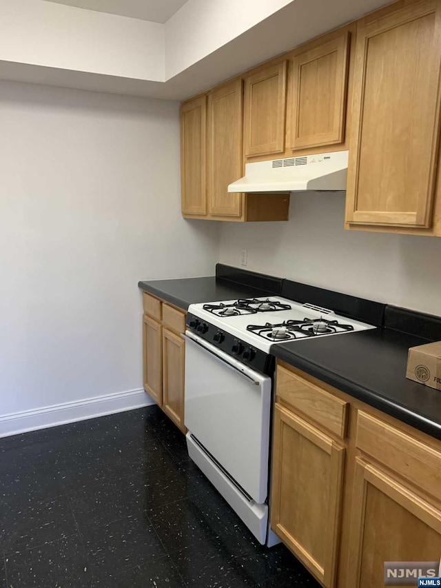 kitchen with white range with gas stovetop