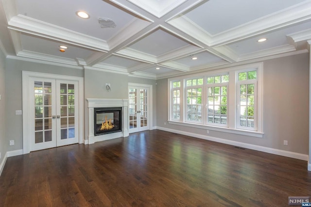 unfurnished living room featuring beamed ceiling, ornamental molding, french doors, and coffered ceiling