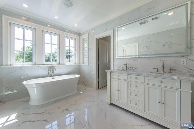 bathroom featuring vanity, tile walls, crown molding, and a bath