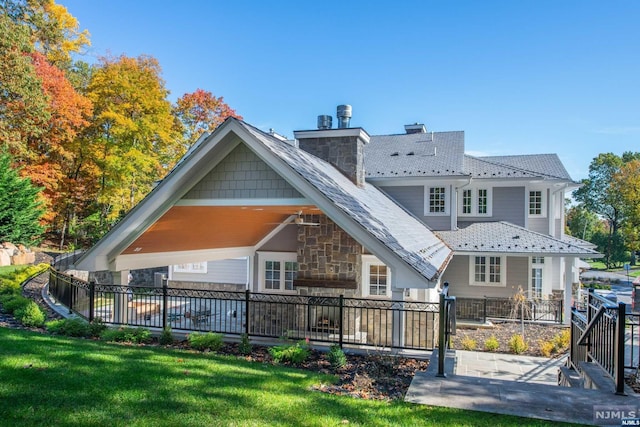 back of property featuring a patio and a yard