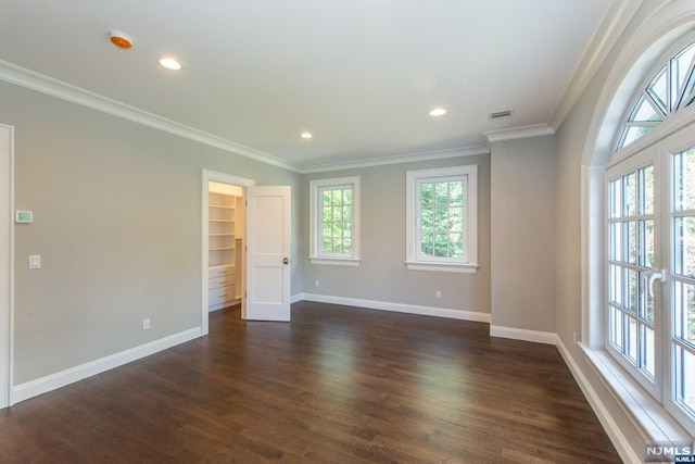 unfurnished room featuring dark hardwood / wood-style floors and ornamental molding