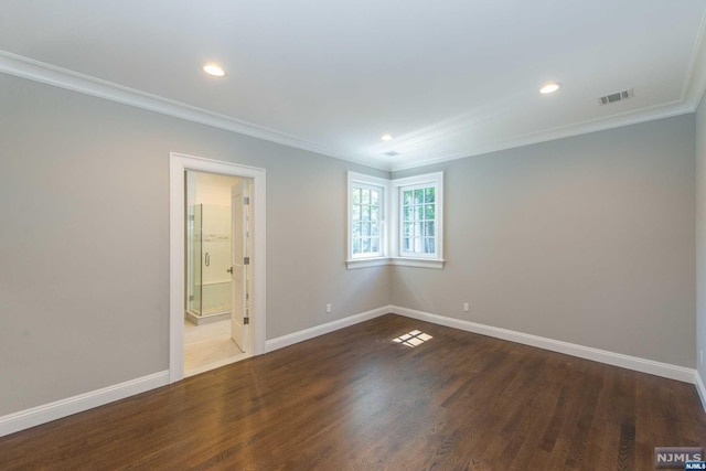 unfurnished room with wood-type flooring and crown molding