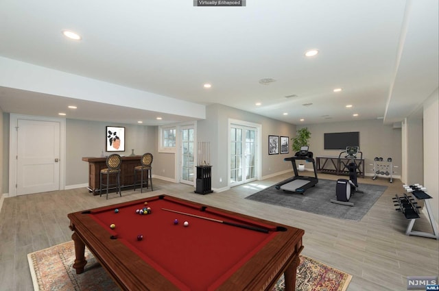 game room with bar area and pool table